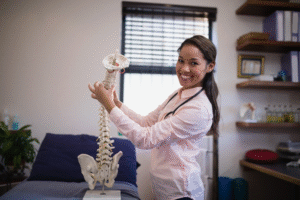 Chiropractor Demonstrating How to Adjust Spine